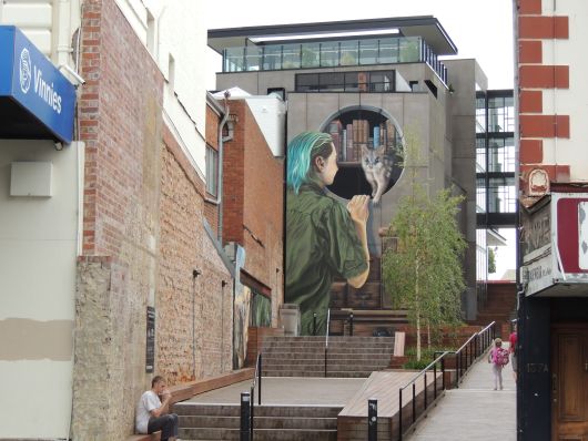 Mural Possum in a bookshelf